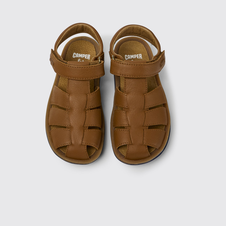 Overhead view of Bicho Brown leather sandals for kids