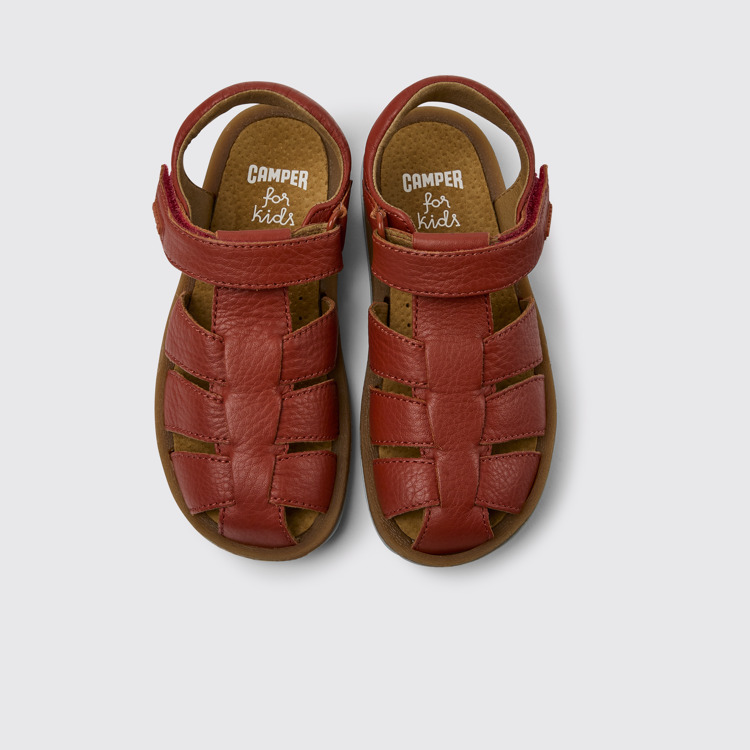 Overhead view of Bicho Red leather sandals for kids