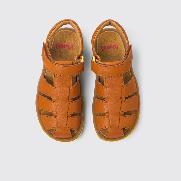 Overhead view of Bicho Brown leather sandals for kids