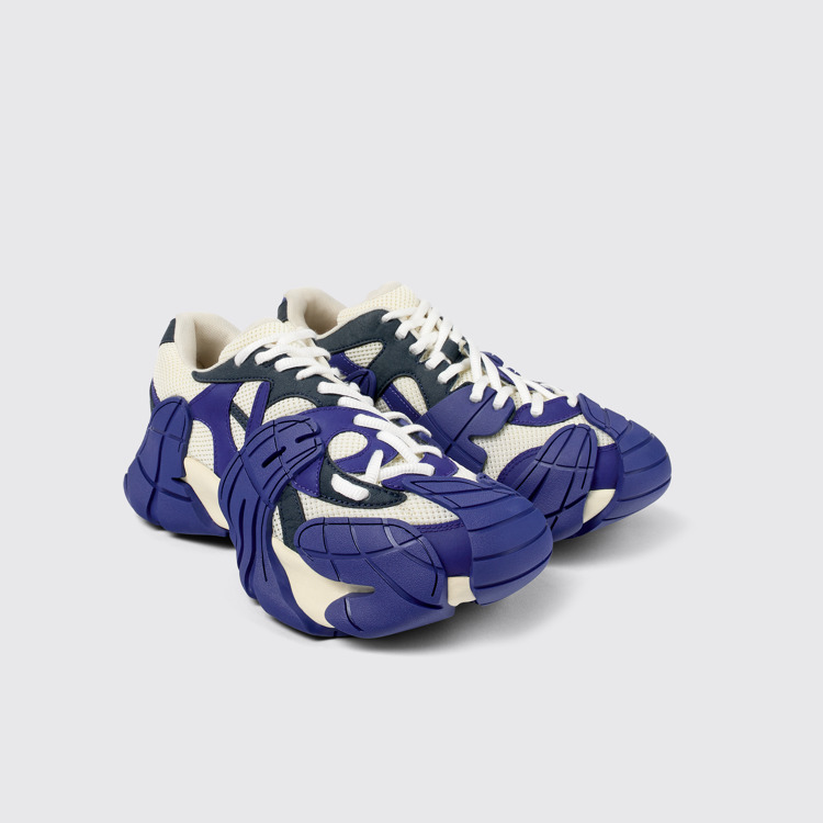 Front view of Tormenta Blue and white sneakers