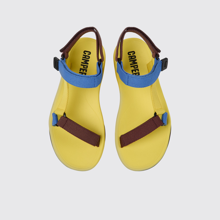 Overhead view of Match Yellow, blue, and burgundy sandals for women