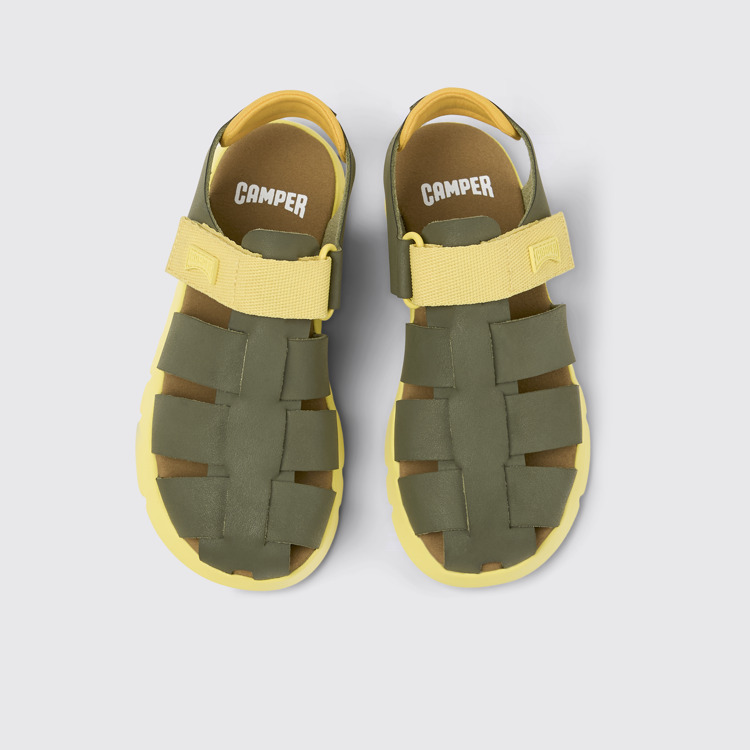 Overhead view of Oruga Green and yellow leather sandals for kids