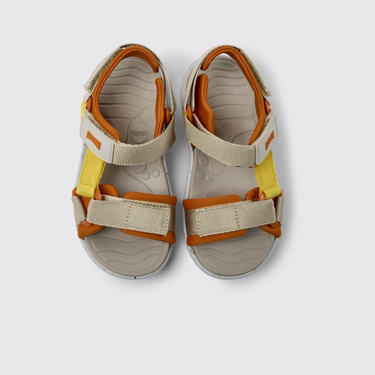 Overhead view of Wous Yellow, orange, and beige sandals for kids