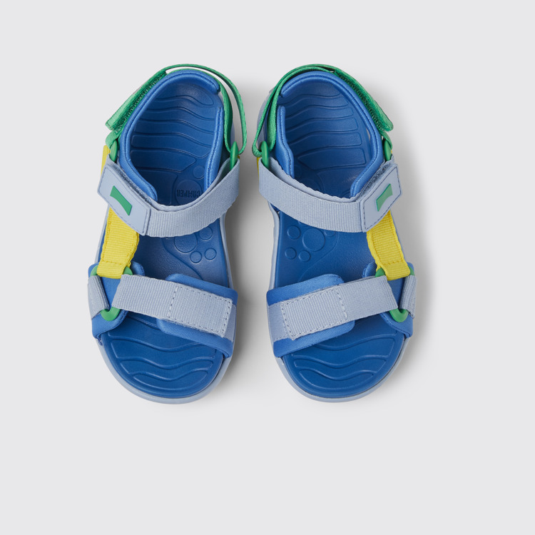 Overhead view of Wous Blue, yellow, and green sandals for kids