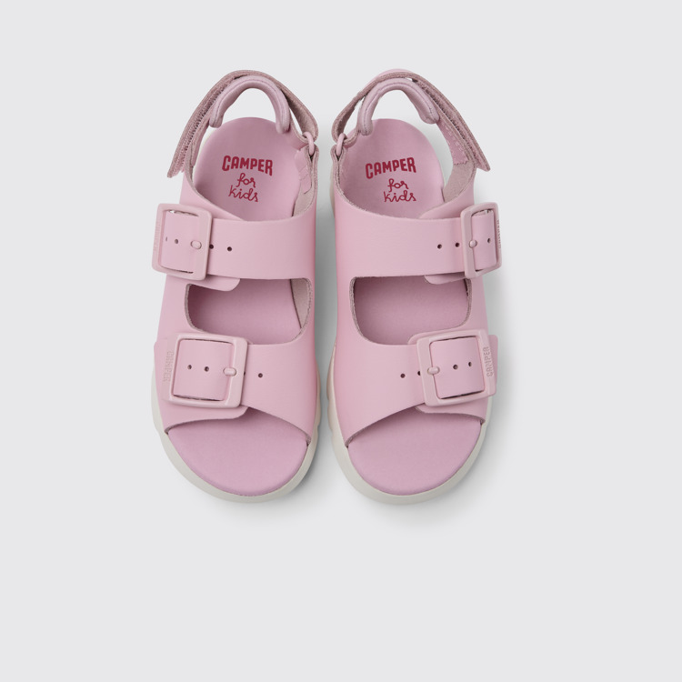 Overhead view of Oruga Pink leather sandals for kids