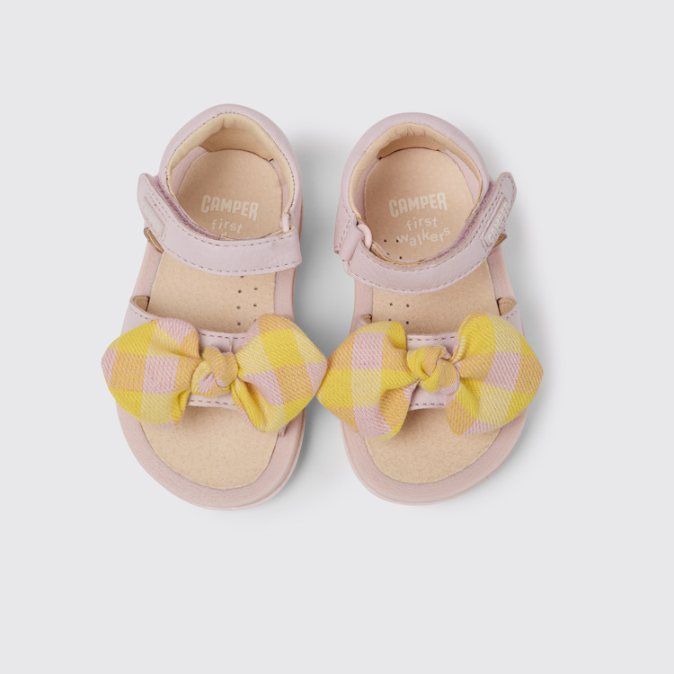 Overhead view of Bicho Pink and yellow sandals for kids