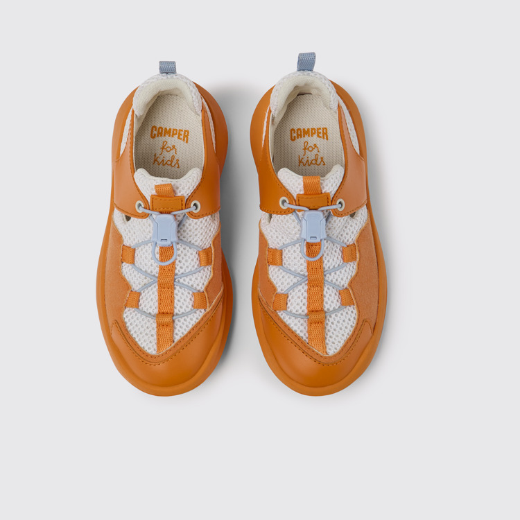 Overhead view of CRCLR White and orange sneakers for kids