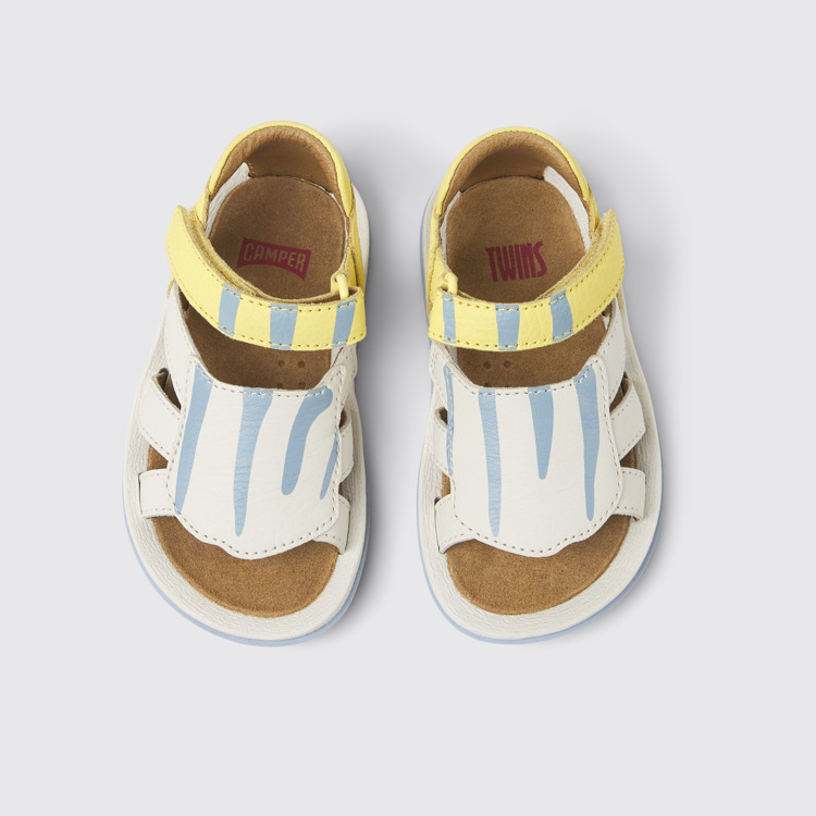 Overhead view of Twins Yellow and white leather sandals for kids