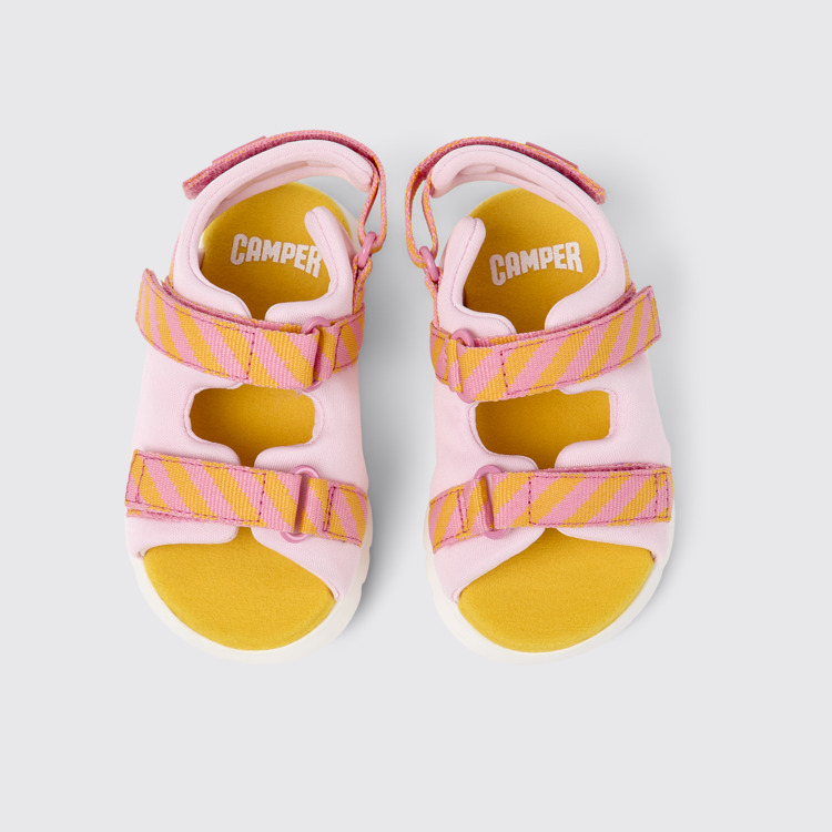 Overhead view of Oruga Pink and orange textile sandals for kids