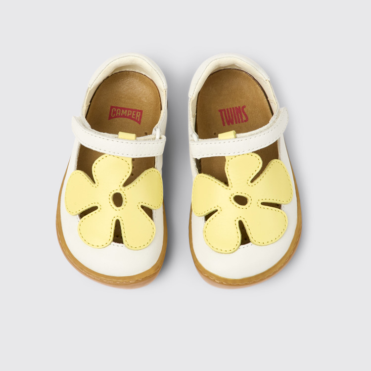 Overhead view of Twins White and yellow leather shoes for kids