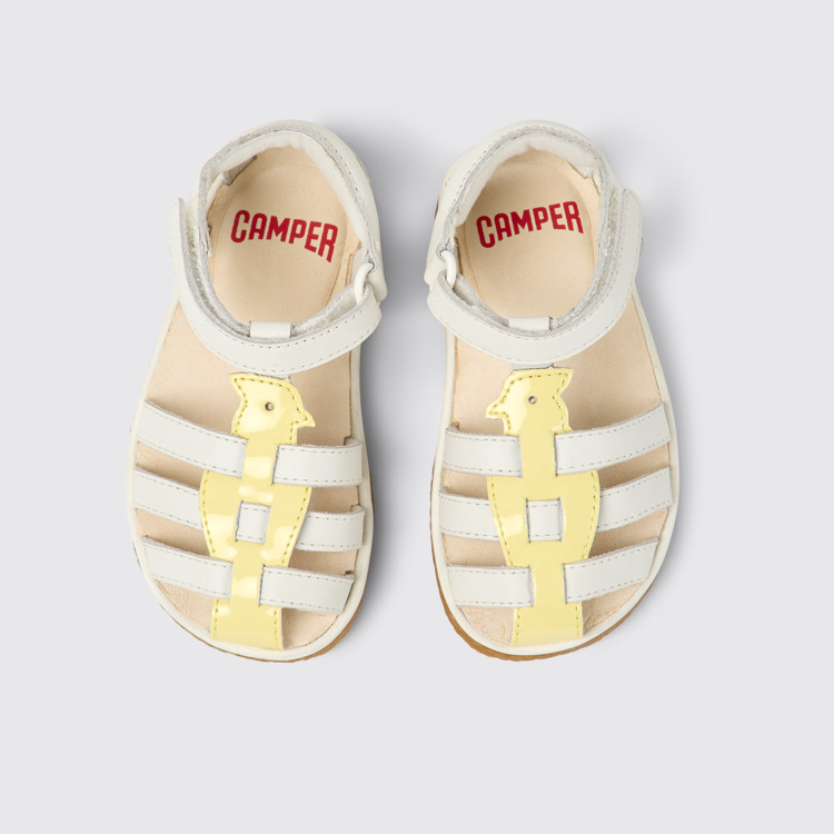 Overhead view of Miko White and yellow leather sandals for kids