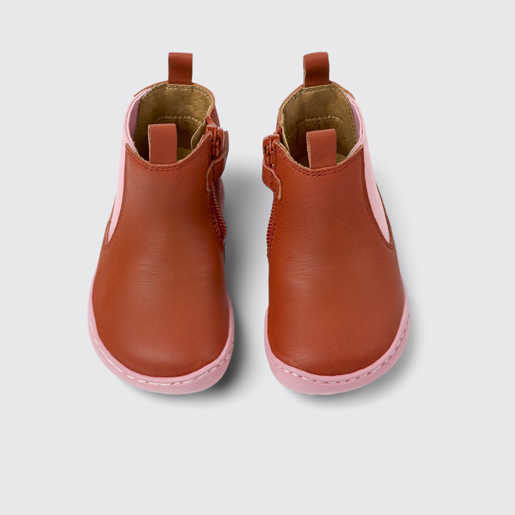 Overhead view of Peu Red and pink leather boots for kids