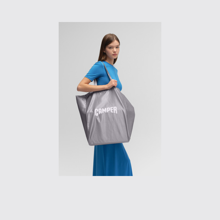 A model wearing Silver Tote Unisex Shoulder Bag