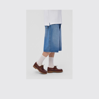 A model wearing Nautico Brown Leather Moccasins for Men.