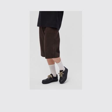 A model wearing Pelotas Black Vegetable Tanned Leather Shoes for Men.