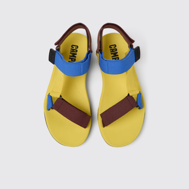 Overhead view of Match Yellow, blue, and burgundy sandals for men