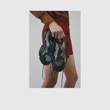 A model wearing Twins Multicolor Leather and Textile Sneakers for Men.