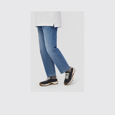 A model wearing Drift Trail Multicolor Textile and Nubuck Sneakers for Men.