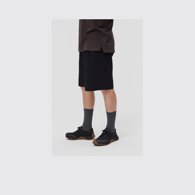 A model wearing Drift Trail Multicolor Textile and Nubuck Sneakers for Men.