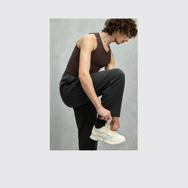 A model wearing Karst Sorona® White Textile Sneaker for Men