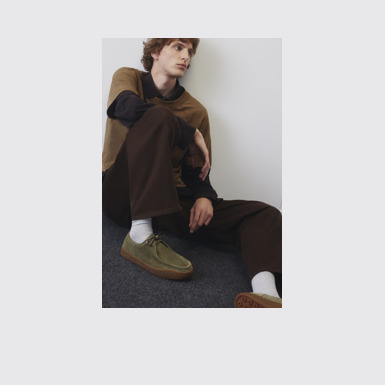 A model wearing Peu Terreno Green Nubuck Shoes for Men.