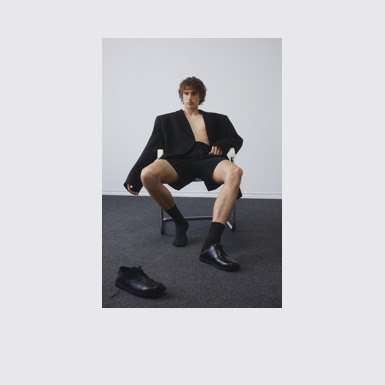 A model wearing Don Black Leather Men's Shoes.