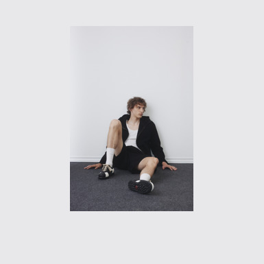 A model wearing Twins Multicolor Leather Men's Shoe.