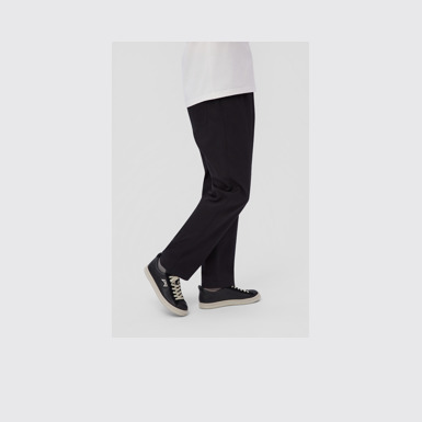 A model wearing Runner Black Leather and Nubuck Sneakers for Men.