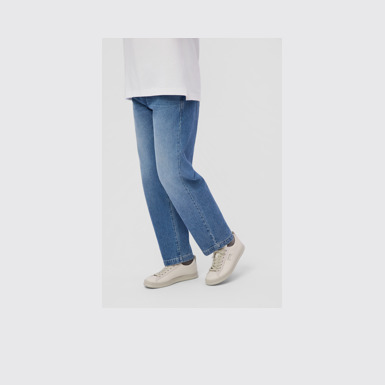 A model wearing Runner White Leather and Nubuck Sneakers for Men.