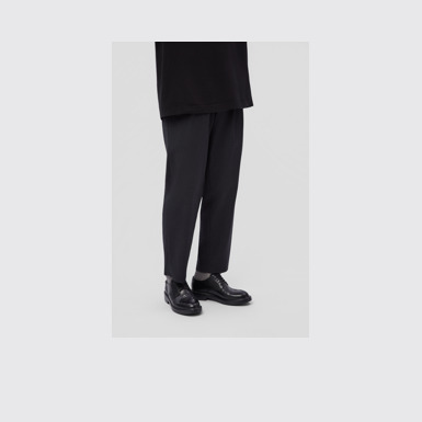 A model wearing Twins Black Leather Shoes for Men.