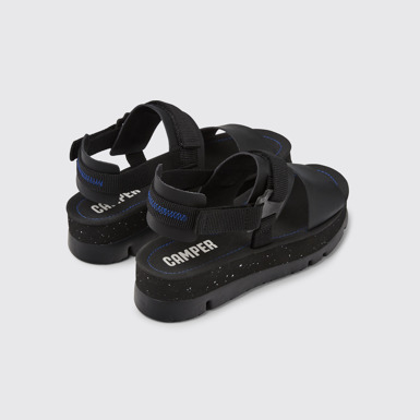 Back view of Oruga Up Black leather sandals for women