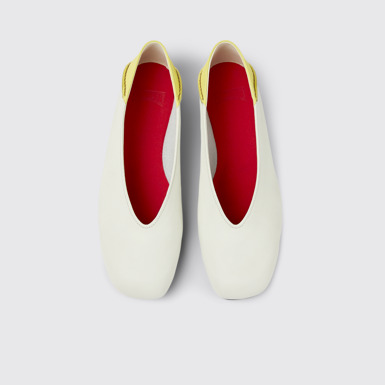 Overhead view of Casi Myra White and yellow leather ballerina flats for women