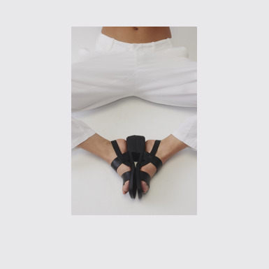 A model wearing Dana Black Leather Sandals for Women.