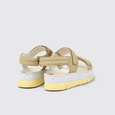 Back view of Oruga Up Beige leather sandals for women