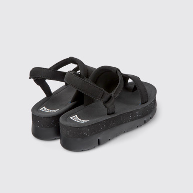 Back view of Oruga Up Black textile sandals for women