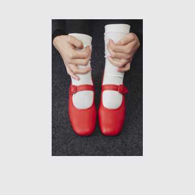 A model wearing Casi Myra Red Leather Shoes for Women.