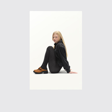 A model wearing Milah Brown Nubuck Sandals for Women.