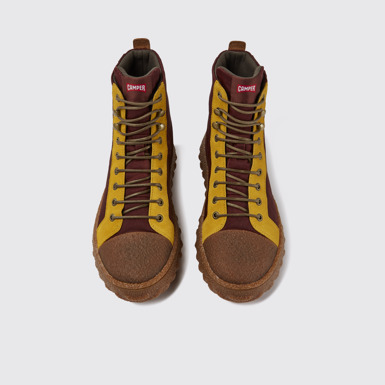 Overhead view of Ground Burgundy and yellow ankle boots
