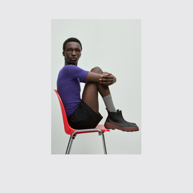 A model wearing Brutus Trek Black nubuck ankle boots for men