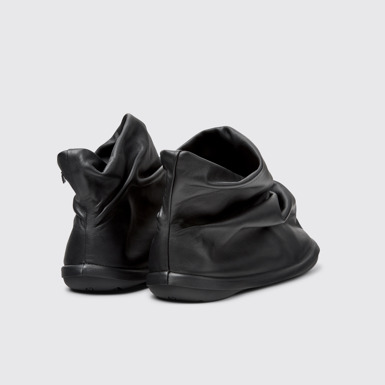 Back view of Camper x ISSEY MIYAKE - Peu Form Black Leather Ankle Boots for Men.