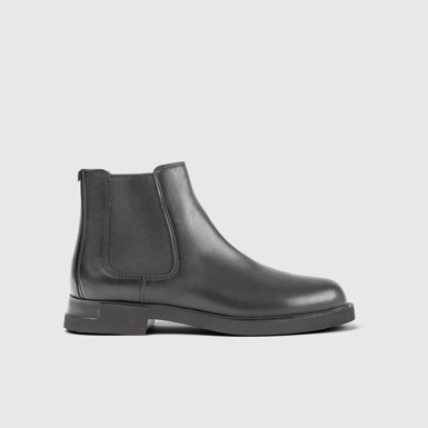 Side view of Iman Black leather chelsea boots for women