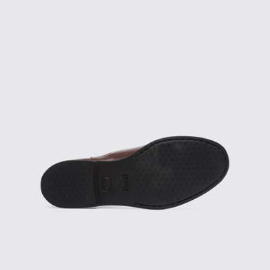 The sole of Iman Women's dark brown ankle boot