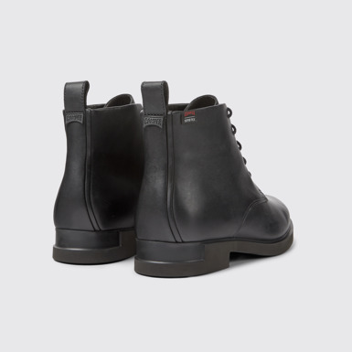 Back view of Iman Women's black lace up ankle boot