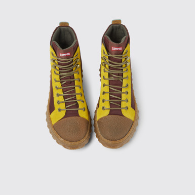 Overhead view of Ground Burgundy and yellow ankle boots