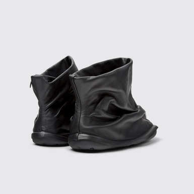 Back view of Camper x ISSEY MIYAKE - Peu Form Black Leather Ankle Boots for Women.