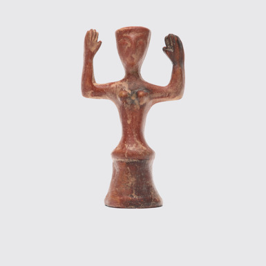Side view of Minoan goddess Ceramic goddess replica