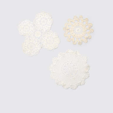 Side view of White handwoven doilies Handmade white and beige doilies