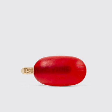 Side view of Camper Soap by Martí Guixé Red soap on stick