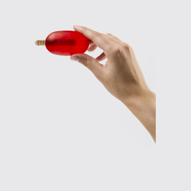 Back view of Camper Soap by Martí Guixé Red soap on stick