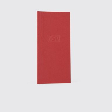 Side view of Camper Notebook by Martí Guixé Red notebook